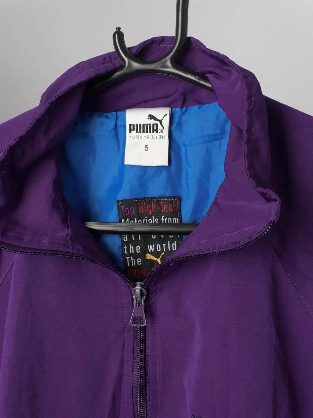 90s vintage Puma windbreaker purple with triangle badge – Medium / Large