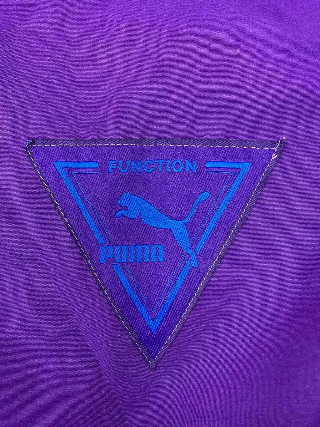 90s vintage Puma windbreaker purple with triangle badge – Medium / Large